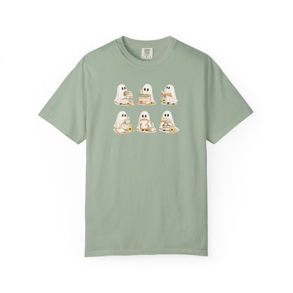 Sage green Comfort Colors t-shirt with six hand-illustrated ghosts holding books, front view - Ghost Teacher Shirt by The Teechers Thread