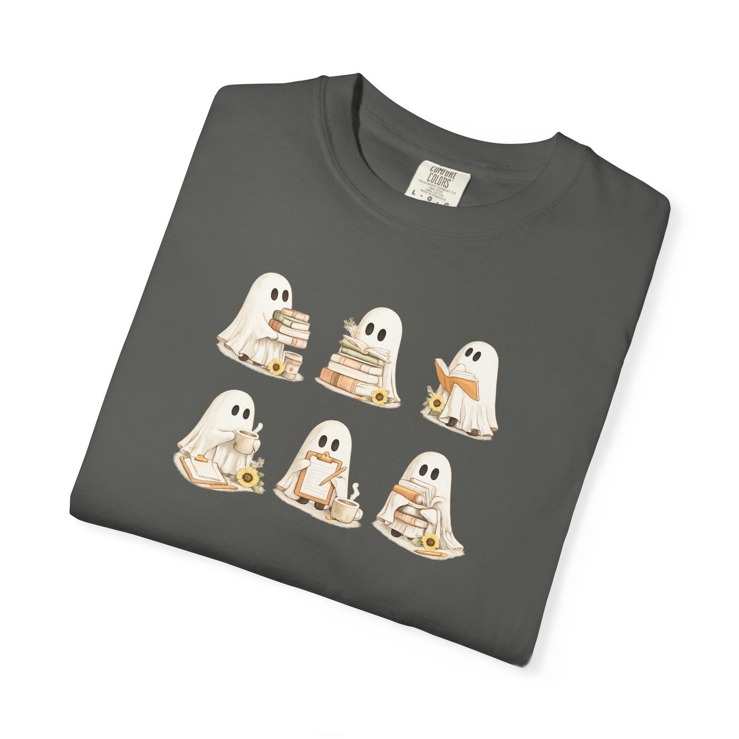 Charcoal grey Comfort Colors t-shirt folded flat lay with six hand-illustrated ghosts holding books design - Ghost Teacher Shirt by The Teechers Thread