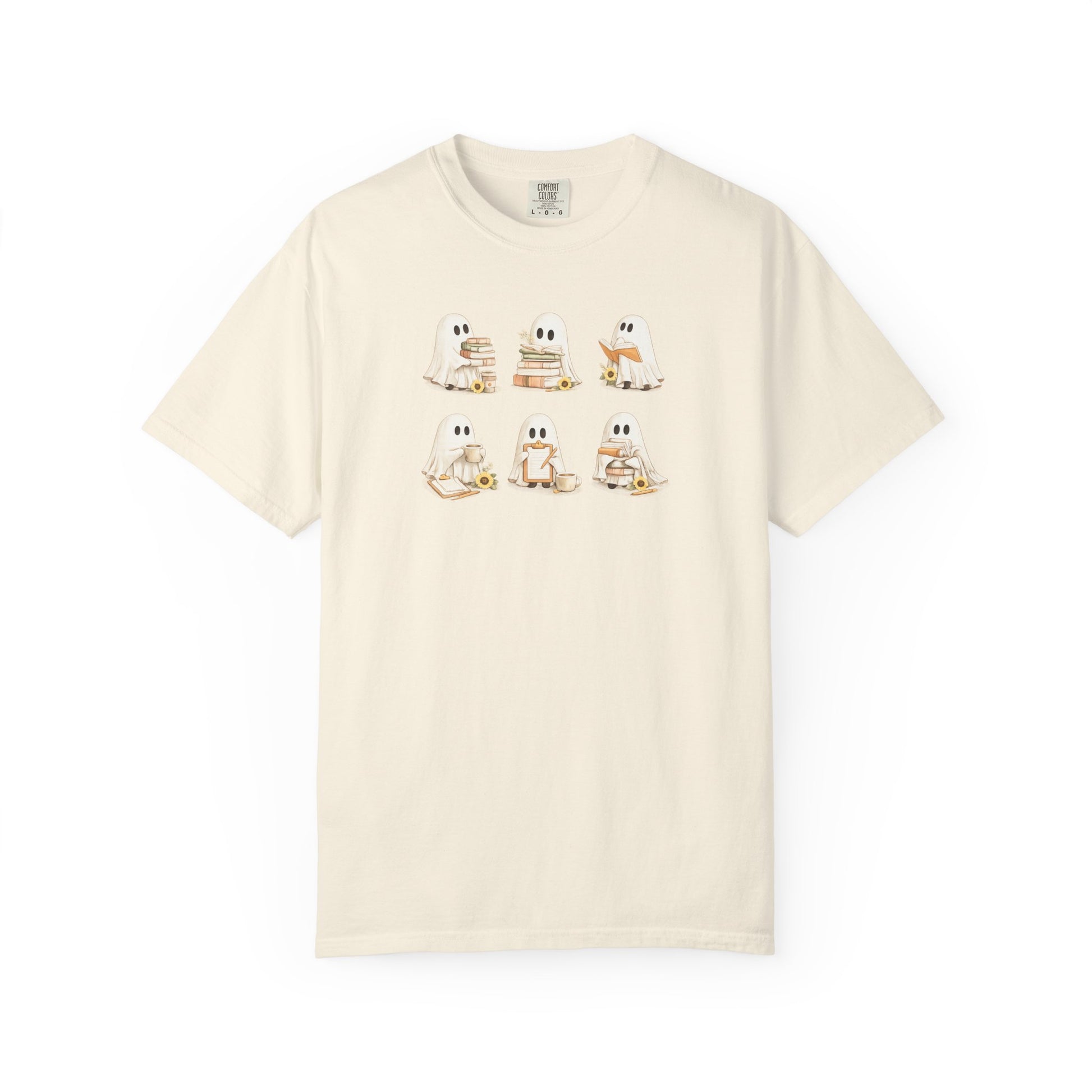 Cream Comfort Colors t-shirt with six hand-illustrated ghosts holding books, front view - Ghost Teacher Shirt by The Teechers Thread