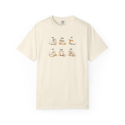 Cream Comfort Colors t-shirt with six hand-illustrated ghosts holding books, front view - Ghost Teacher Shirt by The Teechers Thread