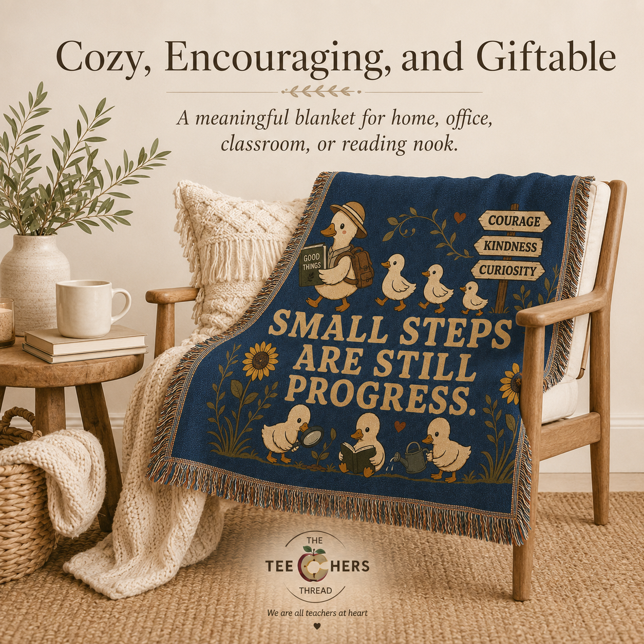 Navy woven blanket with duck and sunflower design draped over a wooden chair in a cozy reading nook - Small Steps Are Still Progress Throw by The Teechers Thread